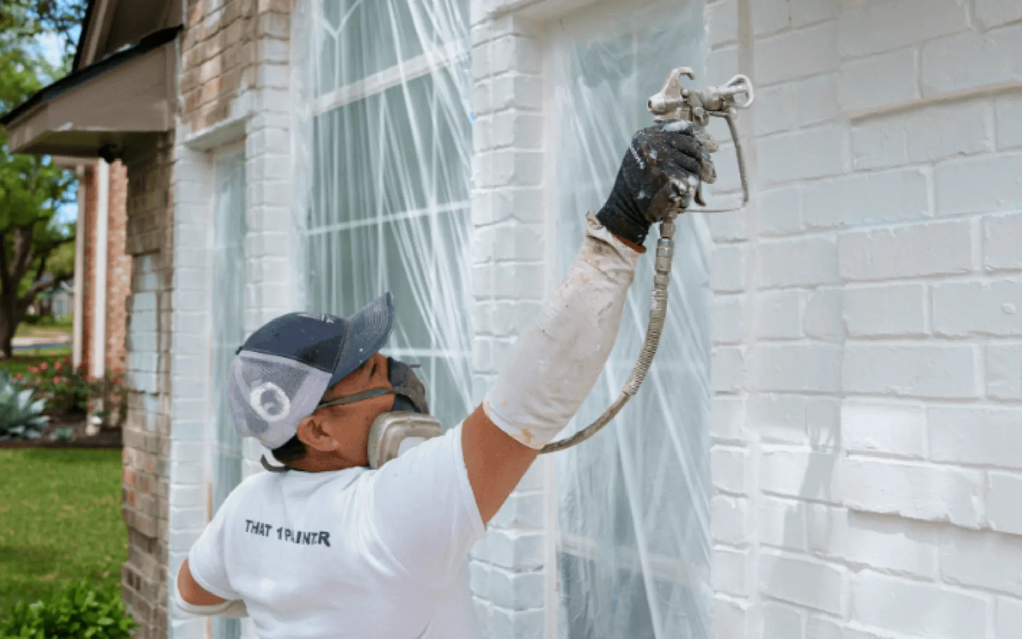 Detail of brick wall painted in warm earth tone with new mortar repair