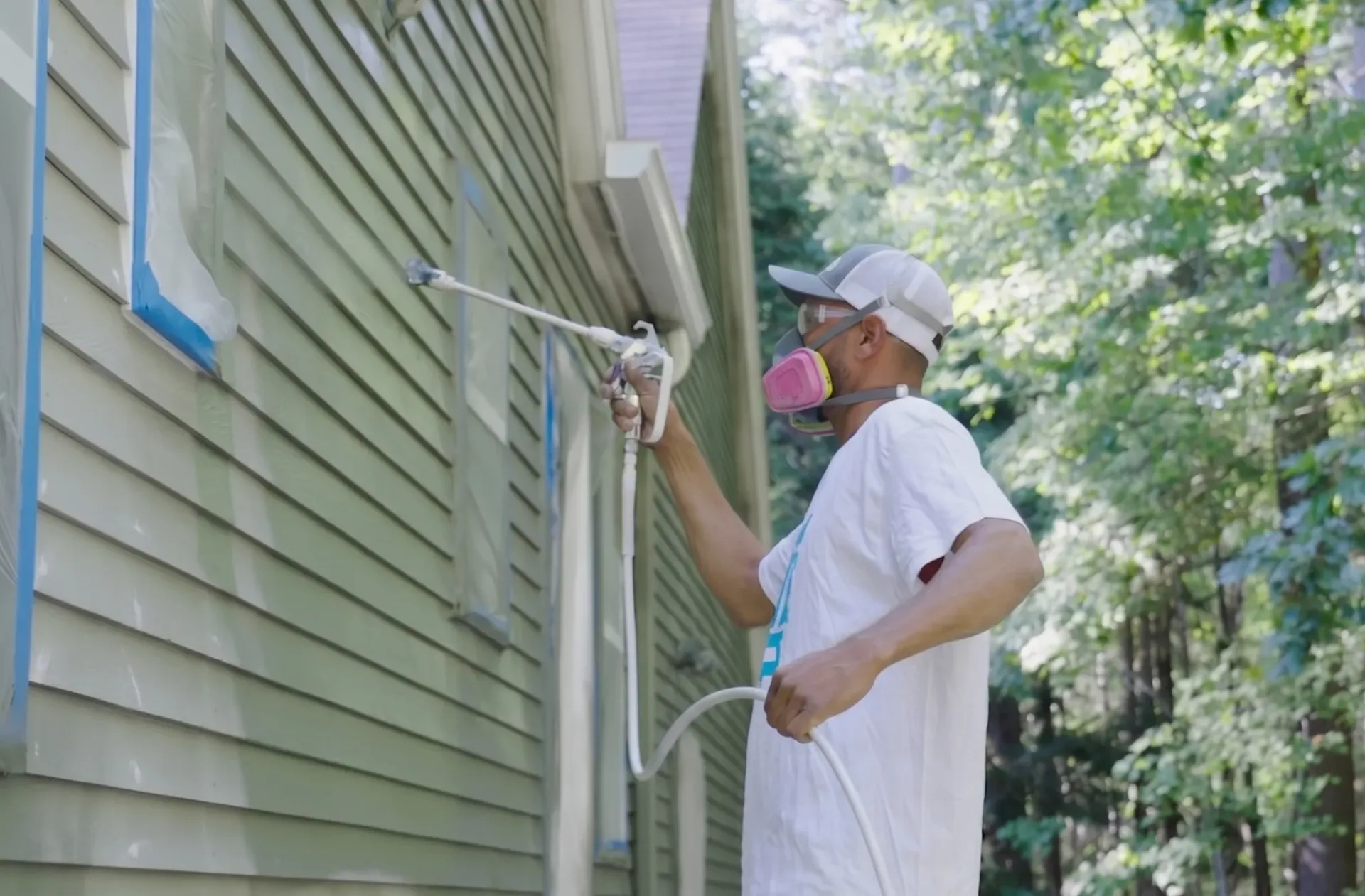 Professionally repainted home exterior, fresh paint protecting siding, trim, and curb appeal