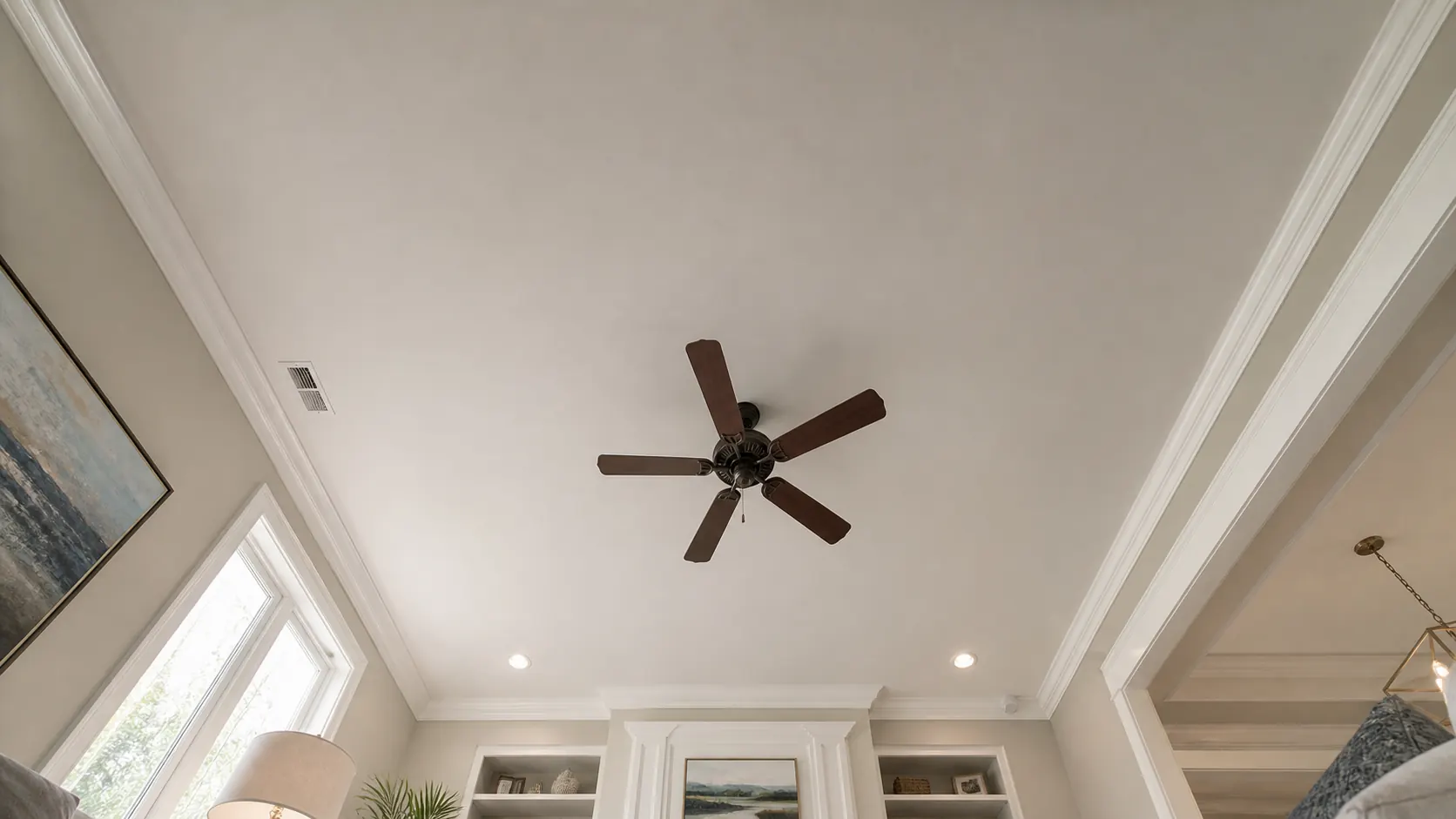 Smooth, finished ceiling after popcorn texture removal and skim coating