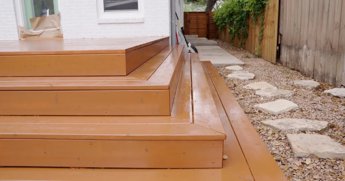 Wood deck steps freshly stained in natural honey tone